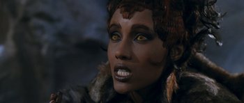 Movie still from “Star Trek VI: The Undiscovered Country” (1991), directed by Nicholas Meyer – A woman's face with yellow eyes; Close Up shot, Over the shoulder angle