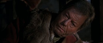 Movie still from “Star Trek VI: The Undiscovered Country” (1991), directed by Nicholas Meyer – An old man with a fur coat is looking at the camera; Close Up shot, Over the shoulder angle