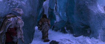 Movie still from “Star Trek VI: The Undiscovered Country” (1991), directed by Nicholas Meyer – A man in a bear suit walking through a cave; Wide shot, High angle