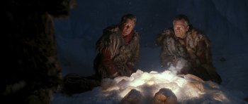 Movie still from “Star Trek VI: The Undiscovered Country” (1991), directed by Nicholas Meyer – Two men in fur coats are crouching in front of a pile of snow; Medium shot, High angle