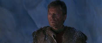 Movie still from “Star Trek VI: The Undiscovered Country” (1991), directed by Nicholas Meyer – An older man wearing a fur coat and standing in the snow; Close Up shot, Low angle