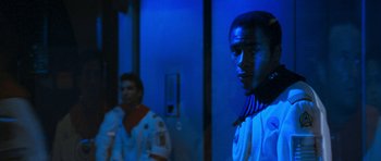 Movie still from “Star Trek VI: The Undiscovered Country” (1991), directed by Nicholas Meyer – A man in white shirt standing next to another man in black shirt; Close Up shot, Over the shoulder angle