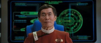 Movie still from “Star Trek VI: The Undiscovered Country” (1991), directed by Nicholas Meyer – A person wearing a uniform; Close Up shot, Low angle