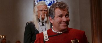 Movie still from “Star Trek VI: The Undiscovered Country” (1991), directed by Nicholas Meyer – A man in a red jacket and a man in a white shirt; Close Up shot, Over the shoulder angle