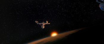 Movie still from “Star Trek VI: The Undiscovered Country” (1991), directed by Nicholas Meyer – An image of a space ship in the middle of the night; Extreme Wide shot, Overhead angle