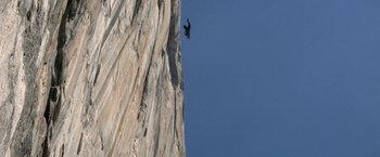 Movie still from “Star Trek V: The Final Frontier” (1989), directed by William Shatner – A black bird flying over a rock cliff; Extreme Wide shot, High angle