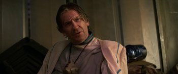 Movie still from “Star Trek V: The Final Frontier” (1989), directed by William Shatner – A person wearing a robe and a necklace; Close Up shot, Over the shoulder angle