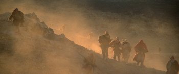 Movie still from “Star Trek V: The Final Frontier” (1989), directed by William Shatner – A group of people walking up a hill in the sand; Extreme Wide shot, High angle