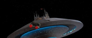 Movie still from “Star Trek V: The Final Frontier” (1989), directed by William Shatner – An image of a space ship in the middle of the night; Extreme Wide shot, Low angle