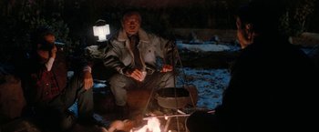 Movie still from “Star Trek V: The Final Frontier” (1989), directed by William Shatner – An old man sitting in front of an open fire; Medium shot, Over the shoulder angle