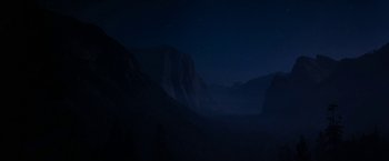 Movie still from “Star Trek V: The Final Frontier” (1989), directed by William Shatner – A view of a mountain range at night with the stars in the sky; Extreme Wide shot, Low angle