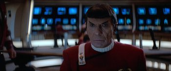 Movie still from “Star Trek V: The Final Frontier” (1989), directed by William Shatner – A man in a red and white uniform; Close Up shot, Over the shoulder angle