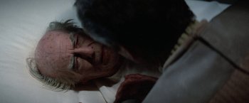Movie still from “Star Trek V: The Final Frontier” (1989), directed by William Shatner – A man laying on a bed with his eyes closed; Close Up shot, Over the shoulder angle