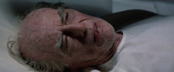Movie still from “Star Trek V: The Final Frontier” (1989), directed by William Shatner – An older man laying down with his eyes closed; Close Up shot, Overhead angle