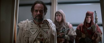 Movie still from “Star Trek V: The Final Frontier” (1989), directed by William Shatner – A man and a woman dressed in ancient clothing; Medium shot, Over the shoulder angle