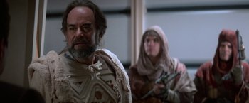 Movie still from “Star Trek V: The Final Frontier” (1989), directed by William Shatner – A man and a woman dressed in medieval garb; Medium shot, Over the shoulder angle