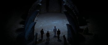 Movie still from “Star Trek V: The Final Frontier” (1989), directed by William Shatner – A group of people standing in a cave; Extreme Wide shot, High angle
