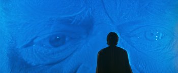 Movie still from “Star Trek V: The Final Frontier” (1989), directed by William Shatner – A man standing in front of a projection screen; Extreme Close Up shot, Over the shoulder angle