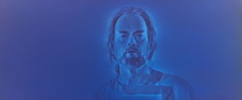 Movie still from “Star Trek V: The Final Frontier” (1989), directed by William Shatner – A man with long hair and a beard is in a blue light; Close Up shot, Low angle