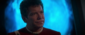 Movie still from “Star Trek V: The Final Frontier” (1989), directed by William Shatner – A person wearing a red shirt; Close Up shot, Over the shoulder angle