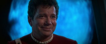 Movie still from “Star Trek V: The Final Frontier” (1989), directed by William Shatner – A person wearing a red shirt; Close Up shot, Over the shoulder angle