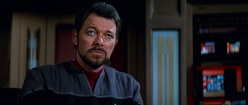 Movie still from “Star Trek: First Contact” (1996), directed by Jonathan Frakes – A person with a beard; Close Up shot, Over the shoulder angle