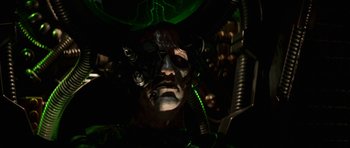 Movie still from “Star Trek: First Contact” (1996), directed by Jonathan Frakes – A man with a face paint and a green light; Close Up shot, Overhead angle