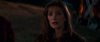 Movie still from “Star Trek: First Contact” (1996), directed by Jonathan Frakes – A person with long brown hair; Close Up shot, Over the shoulder angle