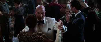 Movie still from “Star Trek: First Contact” (1996), directed by Jonathan Frakes – A man in a white suit is dancing with a woman in a white dress; Close Up shot, Over the shoulder angle