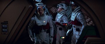 Movie still from “Star Trek: First Contact” (1996), directed by Jonathan Frakes – A group of men in spacesuits standing next to each other; Medium shot, Over the shoulder angle