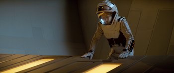 Movie still from “Star Trek: First Contact” (1996), directed by Jonathan Frakes – A man in a space suit is looking down at a piece of wood; Medium shot, Low angle