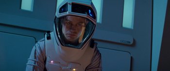 Movie still from “Star Trek: First Contact” (1996), directed by Jonathan Frakes – A man in a spacesuit is looking at the camera; Close Up shot, Low angle