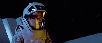 Movie still from “Star Trek: First Contact” (1996), directed by Jonathan Frakes – A man wearing a space suit and a helmet; Close Up shot, Over the shoulder angle