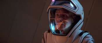 Movie still from “Star Trek: First Contact” (1996), directed by Jonathan Frakes – A man in a space suit looking into a mirror; Close Up shot, High angle