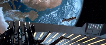 Movie still from “Star Trek: First Contact” (1996), directed by Jonathan Frakes – A man in a space suit is in front of the earth; Wide shot, Overhead angle