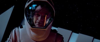 Movie still from “Star Trek: First Contact” (1996), directed by Jonathan Frakes – A man in a space suit is reflected in a mirror; Close Up shot, Overhead angle