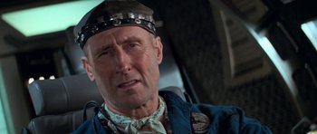 Movie still from “Star Trek: First Contact” (1996), directed by Jonathan Frakes – An older man wearing a hat and a bandana; Close Up shot, Low angle