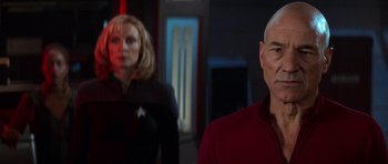 Movie still from “Star Trek: First Contact” (1996), directed by Jonathan Frakes – A man and a woman are standing in a room; Close Up shot, Over the shoulder angle