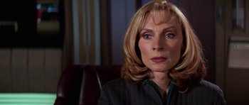 Movie still from “Star Trek: First Contact” (1996), directed by Jonathan Frakes – A person sitting in a chair; Close Up shot, Low angle