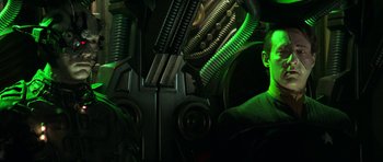 Movie still from “Star Trek: First Contact” (1996), directed by Jonathan Frakes – A man in a green room with a green light; Medium shot, Low angle
