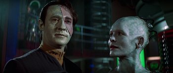 Movie still from “Star Trek: First Contact” (1996), directed by Jonathan Frakes – Two people with face paint on their faces; Close Up shot, Over the shoulder angle