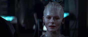 Movie still from “Star Trek: First Contact” (1996), directed by Jonathan Frakes – A person with a bald head; Close Up shot, Over the shoulder angle