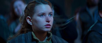 Movie still from “Star Trek: First Contact” (1996), directed by Jonathan Frakes – A young woman with blue eyes stares into the distance; Close Up shot, Low angle