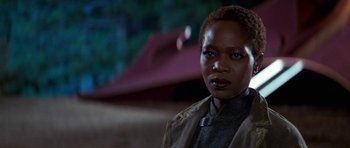 Movie still from “Star Trek: First Contact” (1996), directed by Jonathan Frakes – A person with short hair; Close Up shot, Over the shoulder angle