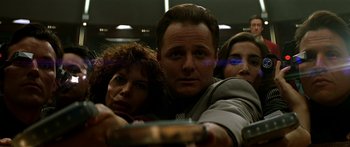 Movie still from “Star Trek: Generations” (1994), directed by David Carson – A man and two women on a train; Close Up shot, Low angle