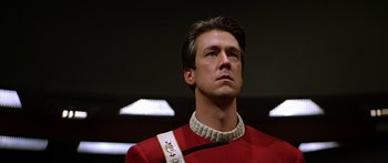 Movie still from “Star Trek: Generations” (1994), directed by David Carson – A person wearing a red uniform; Close Up shot, Low angle