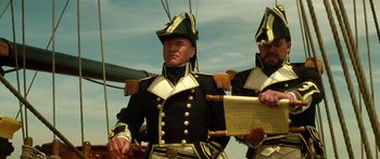 Movie still from “Star Trek: Generations” (1994), directed by David Carson – Two men in military uniforms are standing next to each other; Medium shot, Low angle