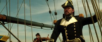 Movie still from “Star Trek: Generations” (1994), directed by David Carson – A man in a pirate costume on a boat; Medium shot, Low angle