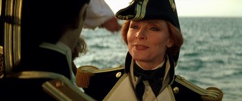 Movie still from “Star Trek: Generations” (1994), directed by David Carson – An older woman in a naval uniform looking at a man; Close Up shot, Over the shoulder angle