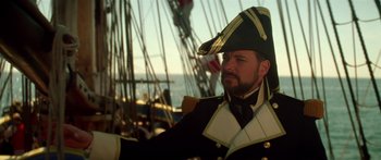 Movie still from “Star Trek: Generations” (1994), directed by David Carson – A man wearing a hat and a uniform; Close Up shot, Over the shoulder angle